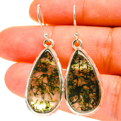 Teardrop moss agate earrings with silver-tone hooks, green and black veining.