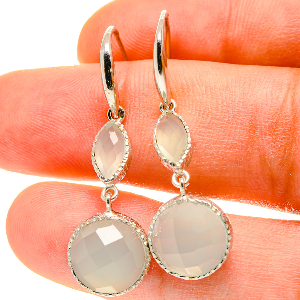 Silver-tone aqua chalcedony dangle earrings with oval and round faceted stones