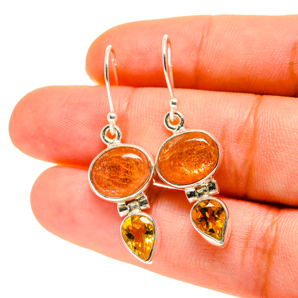 Silver dangle earrings with orange round stones and yellow teardrop drop accents