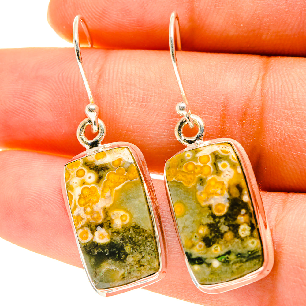 Rectangular ocean jasper dangle earrings with sterling silver hooks, yellow and green stone.