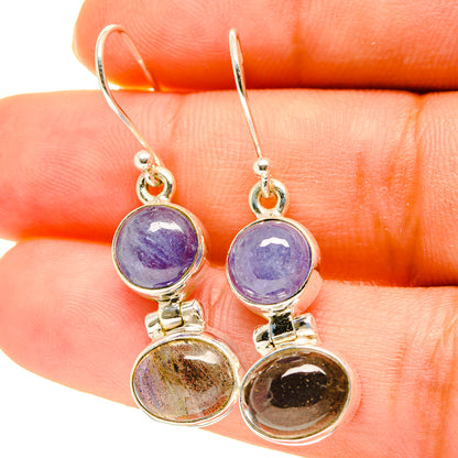 Sterling silver drop earrings with purple and dark round stones and hook backs