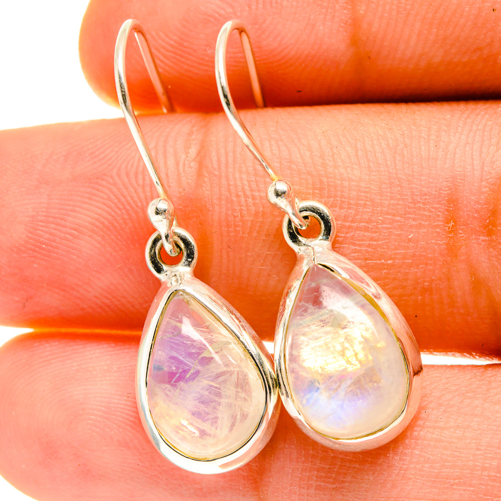 Moonstone drop earrings in teardrop setting with iridescent pink tones, sterling silver hooks