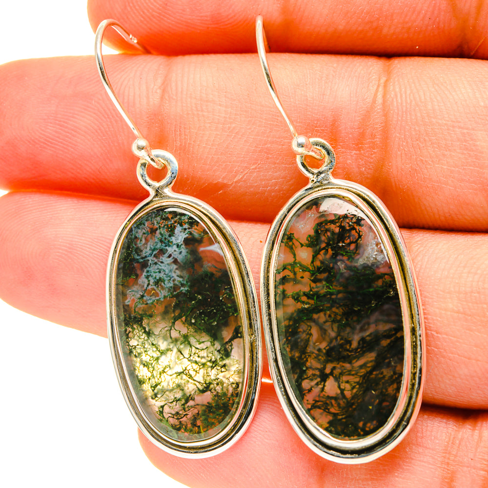 Closeup oval green moss agate earrings with sterling silver hooks and oval bezels