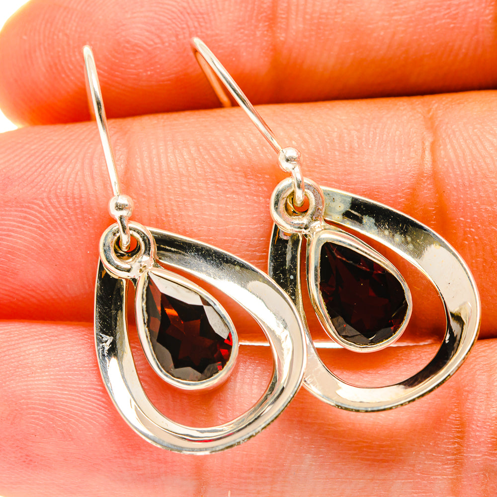 Sterling silver garnet teardrop earrings with red faceted stones and hook backs