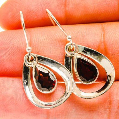 Sterling silver garnet teardrop earrings with red faceted stones and hook backs