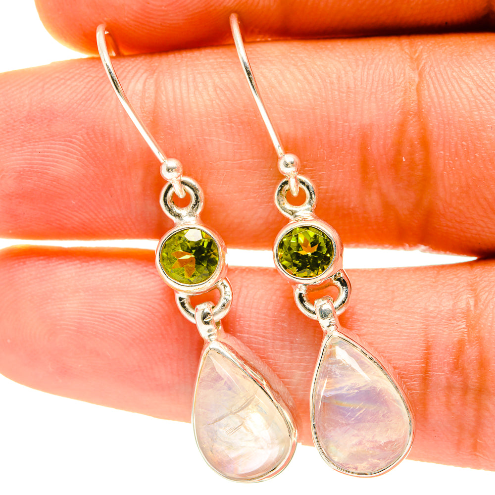 Sterling silver drop earrings with green peridot stones and opal-like teardrop dangles