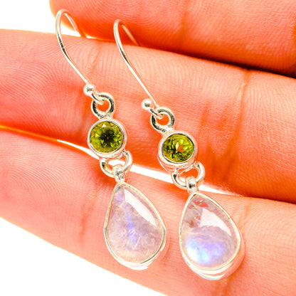 Sterling silver drop earrings, green peridot discs with iridescent pear moonstone pendants