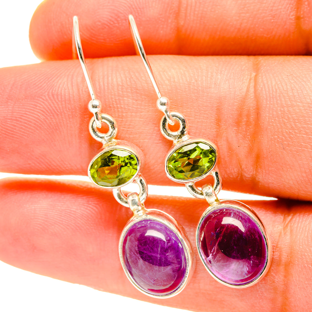 Sterling silver drop earrings with green peridot and purple amethyst oval stones