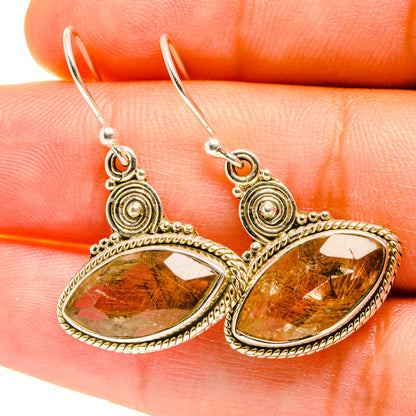 Rutilated quartz drop earrings with oval amber stones, spiral details, and 925 sterling silver hooks.