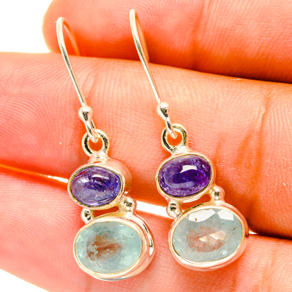 Gold-tone drop earrings with purple top and aqua bottom oval gemstones