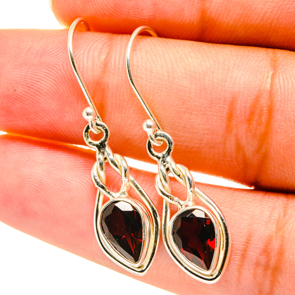 Garnet drop earrings in sterling silver with oval faceted garnet accents