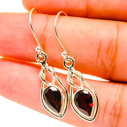 Garnet drop earrings in sterling silver with oval faceted garnet accents