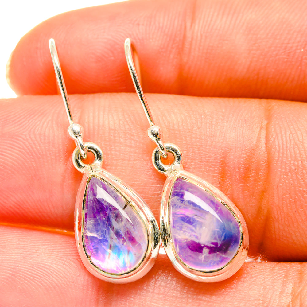 Teardrop purple earrings with silver hooks and bezel-set stone detail
