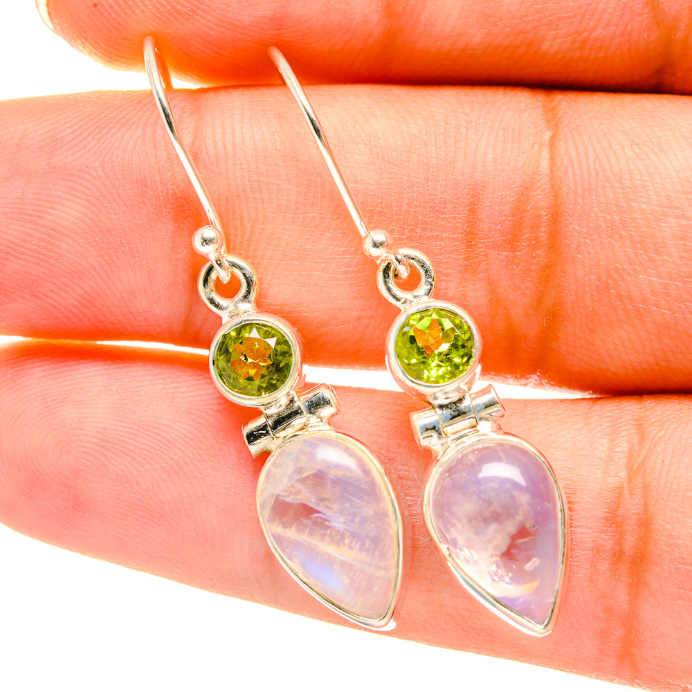 Sterling silver earrings with green peridot bezel settings and moonstone teardrop drops