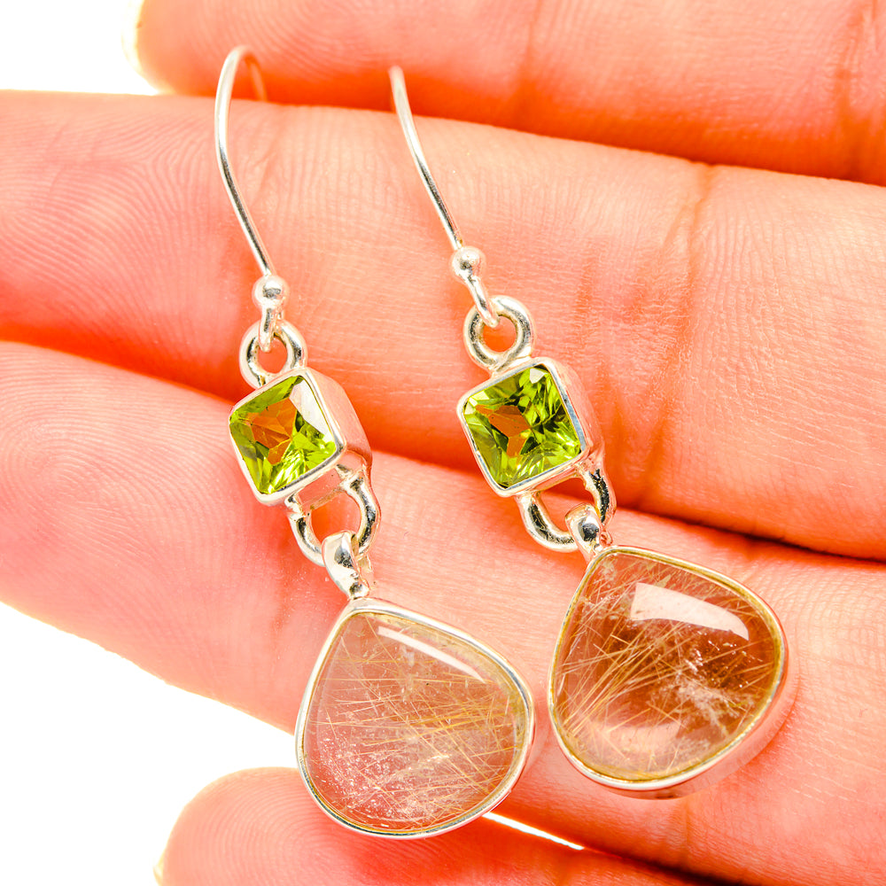 Sterling silver drop earrings with peridot green accents and pink rutilated quartz drops