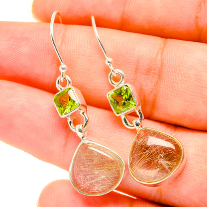 Sterling silver drop earrings with peridot green accents and pink rutilated quartz drops