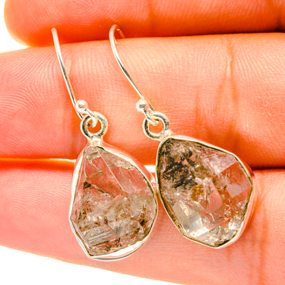 Faceted teardrop gemstone earrings with small metal loops and dangling hooks