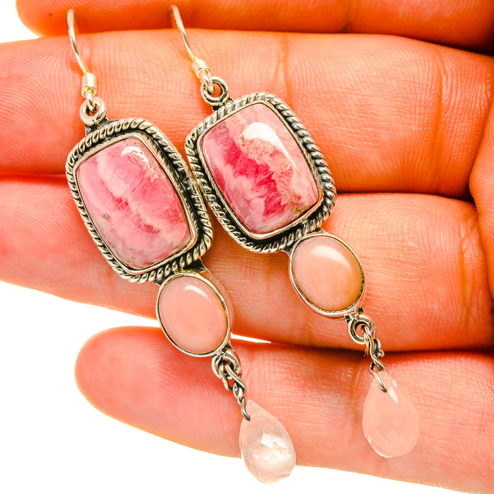 Silver drop earrings with pink rectangle stone, orange cabochon, and peach teardrop