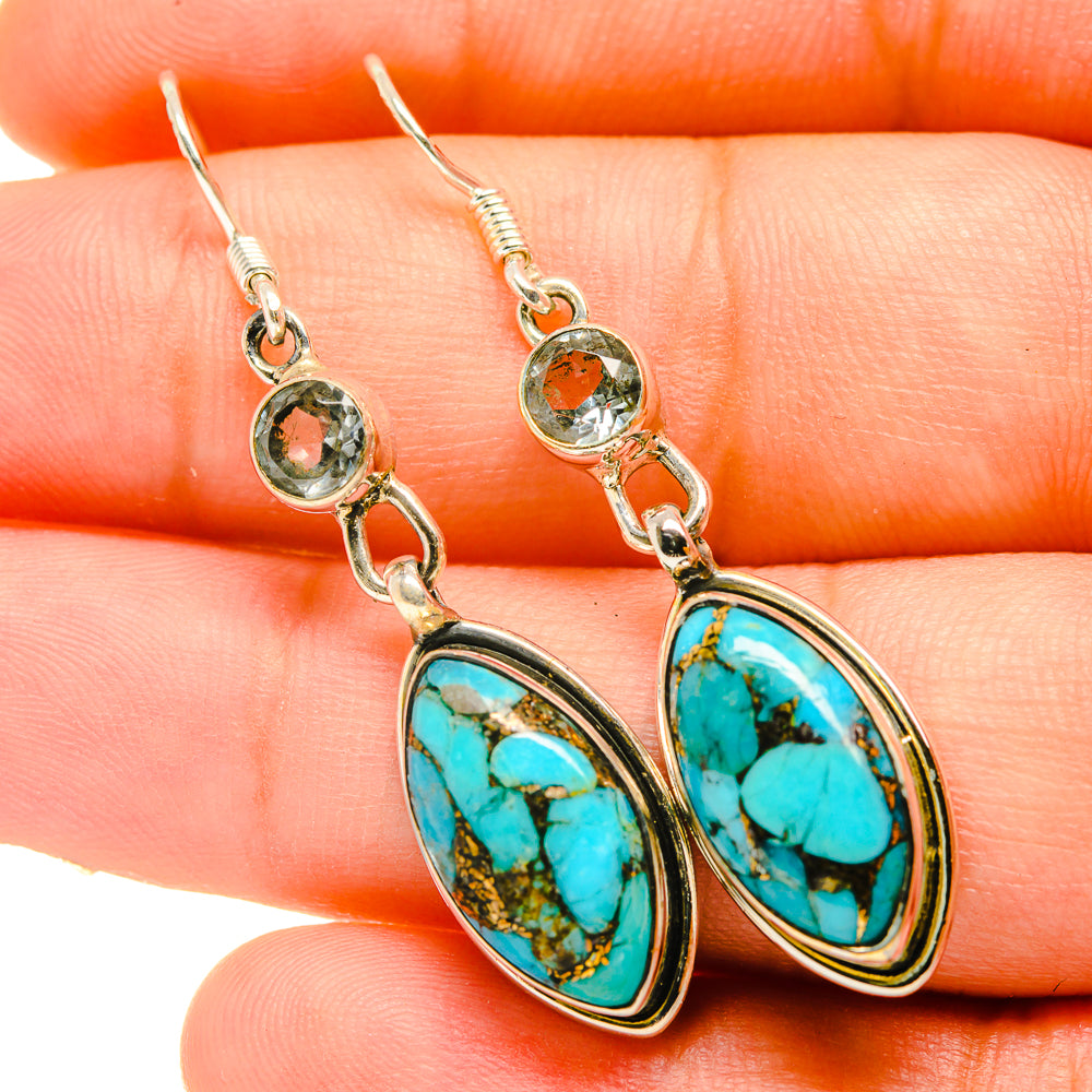 Silver drop earrings with oval turquoise cabochons and small orange accents