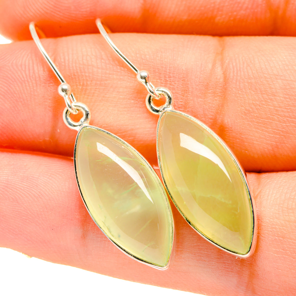 Silver drop earrings with pale green teardrop prehnite stones on shepherd hooks