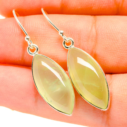 Silver drop earrings with pale green teardrop prehnite stones on shepherd hooks