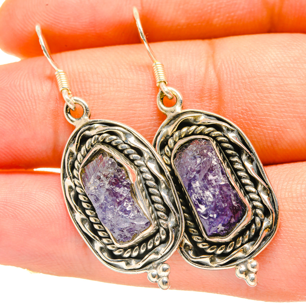 Sterling silver tanzanite earrings with oval rough purple stones, rope border settings