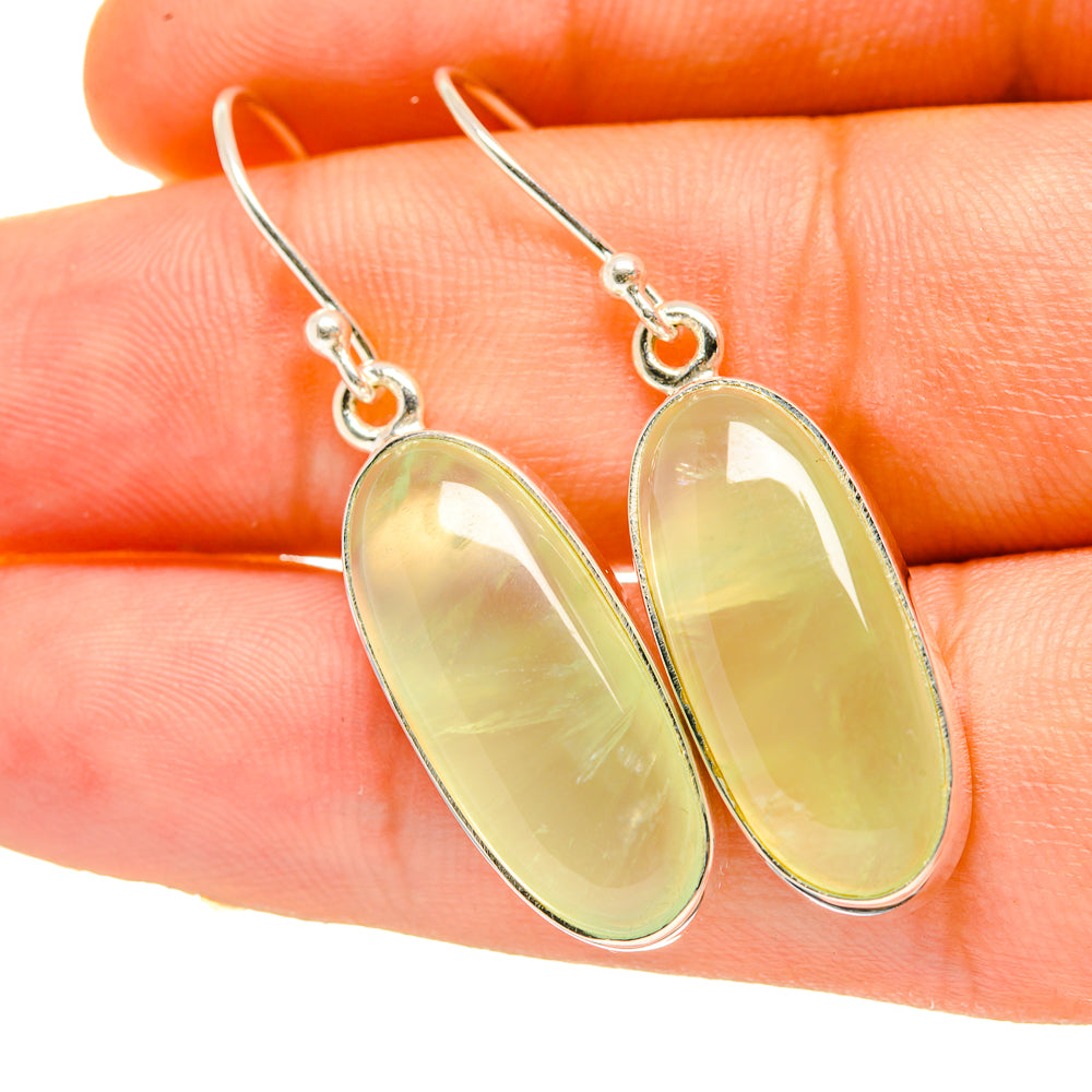 Oval prehnite gemstone drop earrings with silver-tone hooks, pale yellow-green