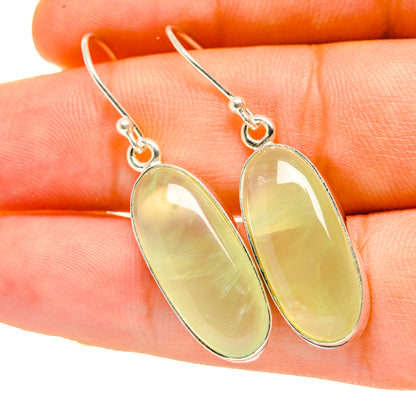Oval prehnite gemstone drop earrings with silver-tone hooks, pale yellow-green