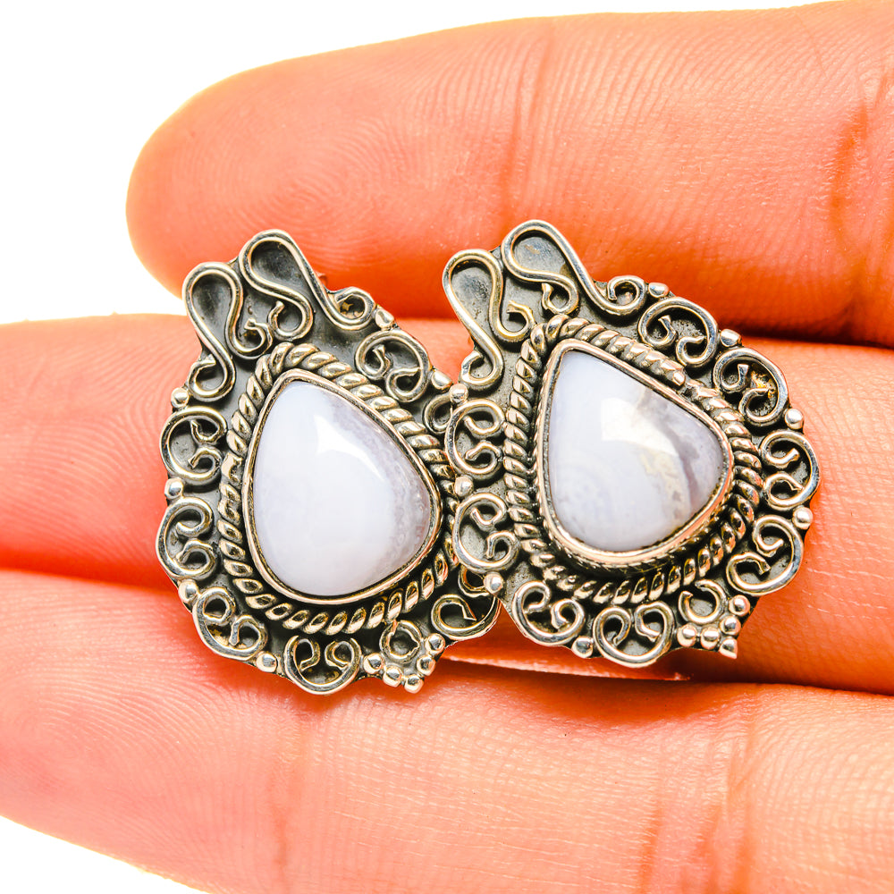 Silver-tone teardrop 925 sterling earrings with blue lace agate cabochons and ornate border