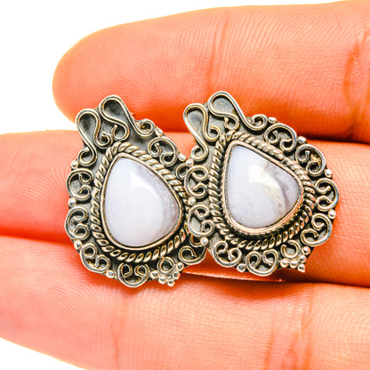 Silver-tone teardrop 925 sterling earrings with blue lace agate cabochons and ornate border
