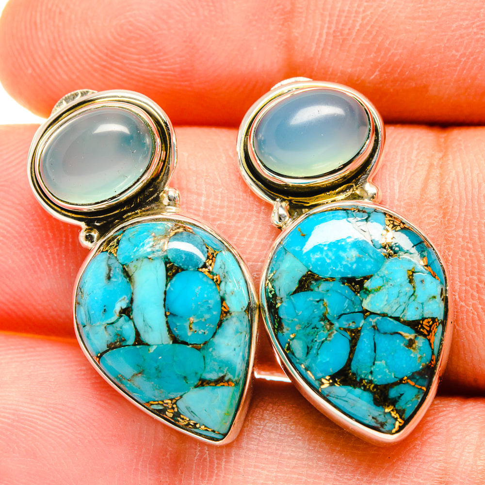 Turquoise cabochon earrings with marbled stone, silver-tone settings and gold bezels