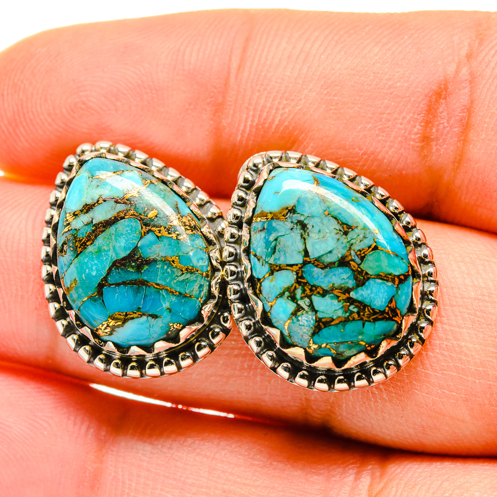 Oval turquoise cabochon earrings with silver-tone beaded bezel