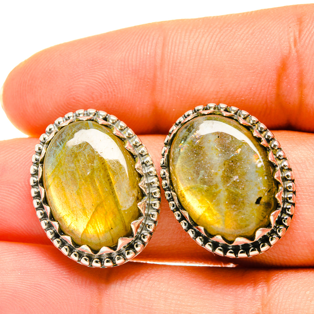 Labradorite stud earrings with oval golden-yellow stone and silver halo settings