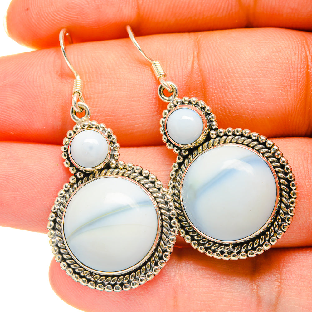 Oval opal-look drop earrings in silver tone with beaded border and fishhook backs