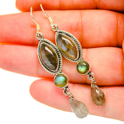 Sterling silver labradorite drop earrings with oval stones, green accents, and crystal dangles
