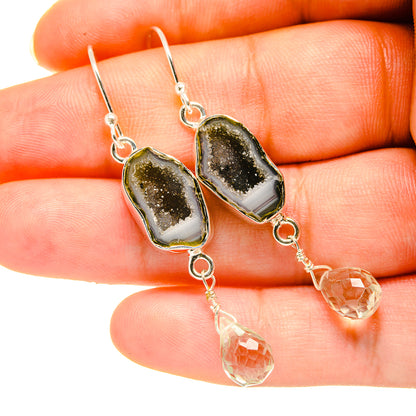 Sterling silver drop earrings with dark druzy geode pendants and clear quartz teardrops