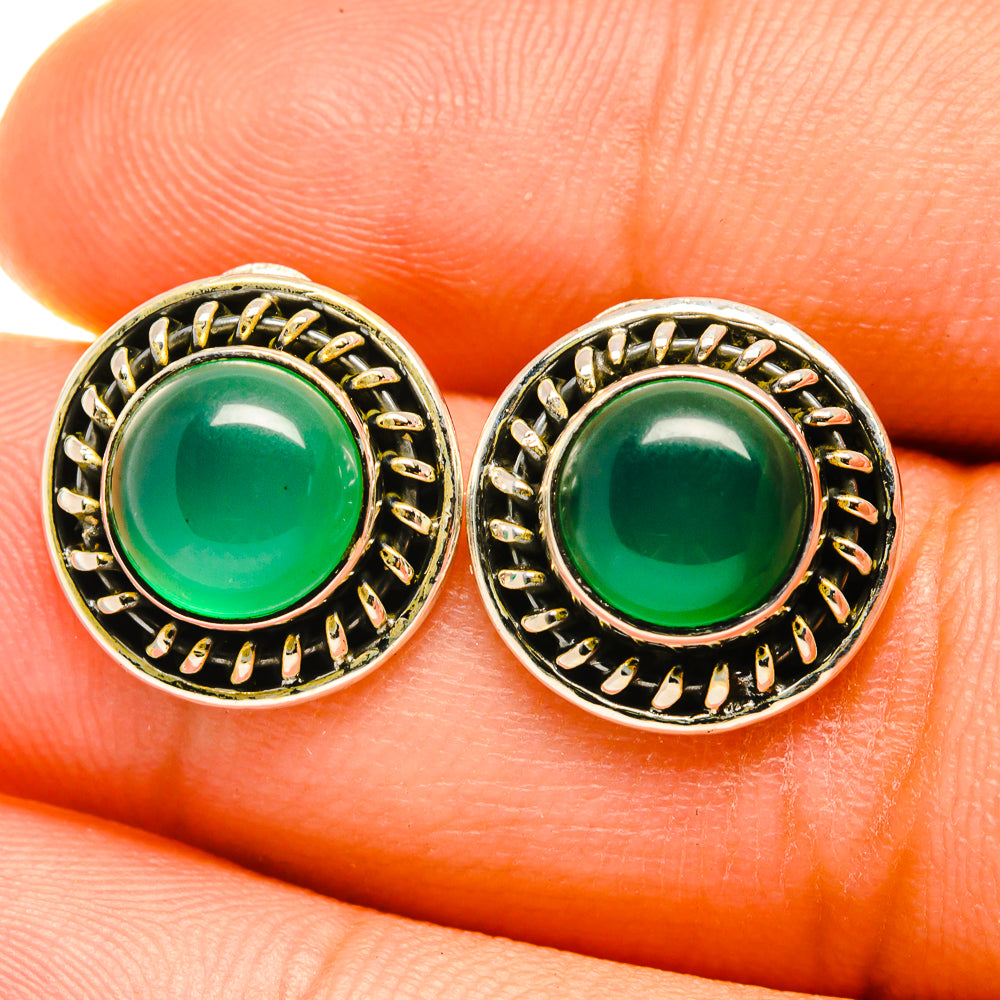 Green onyx stud earrings in ornate sterling silver bezel, round cabochon close-up