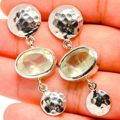 Sterling silver earrings with oval pale green prehnite stones and round hammered charms