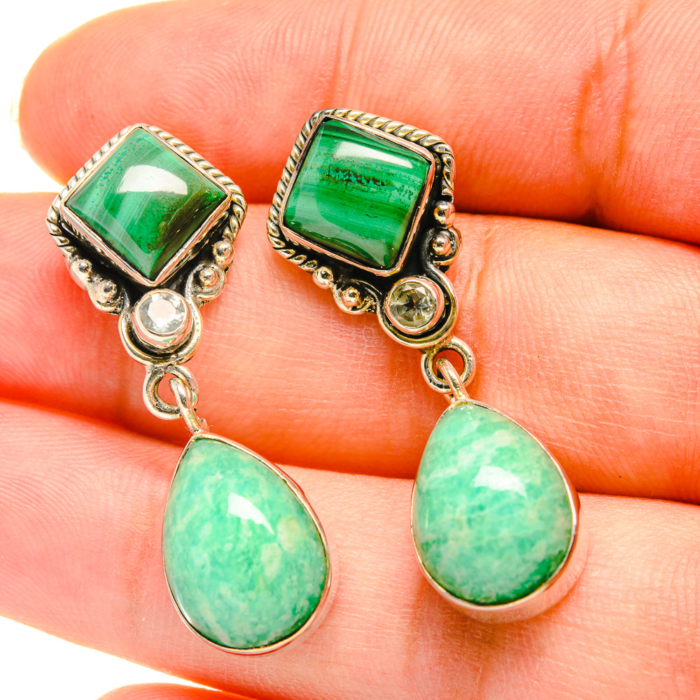 Green gemstone drop earrings with oval dangles and silver-tone settings