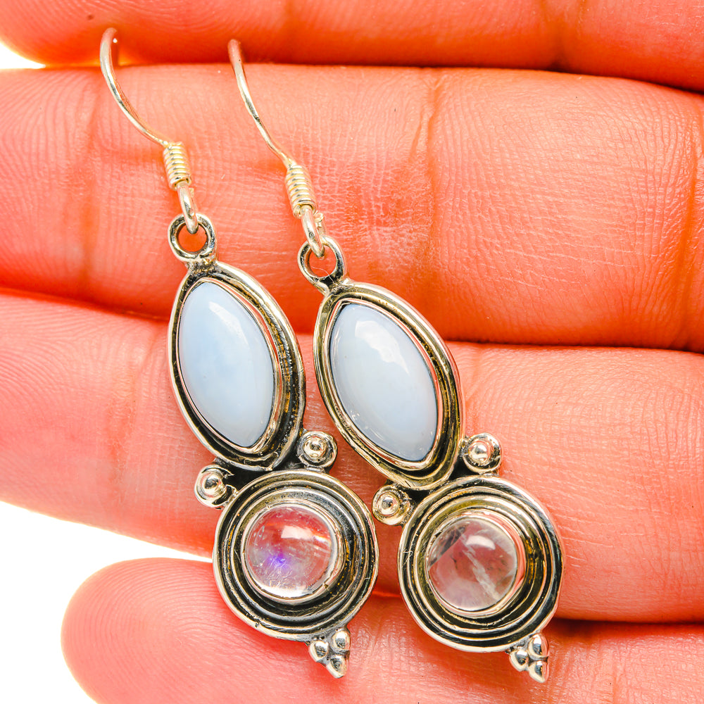Rainbow moonstone earrings: oval blue opal with round pink stone, silver-tone dangles