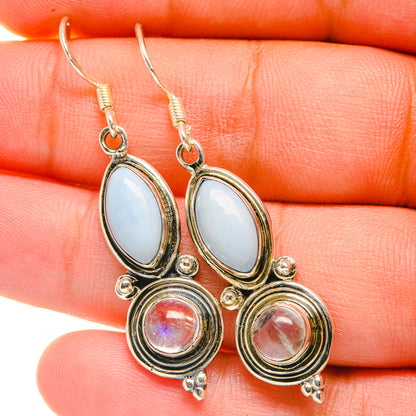 Rainbow moonstone earrings: oval blue opal with round pink stone, silver-tone dangles