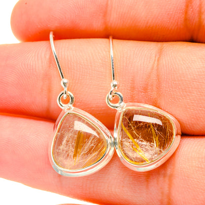 Rutilated quartz teardrop earrings with golden rutile strands in clear stone, silver hooks