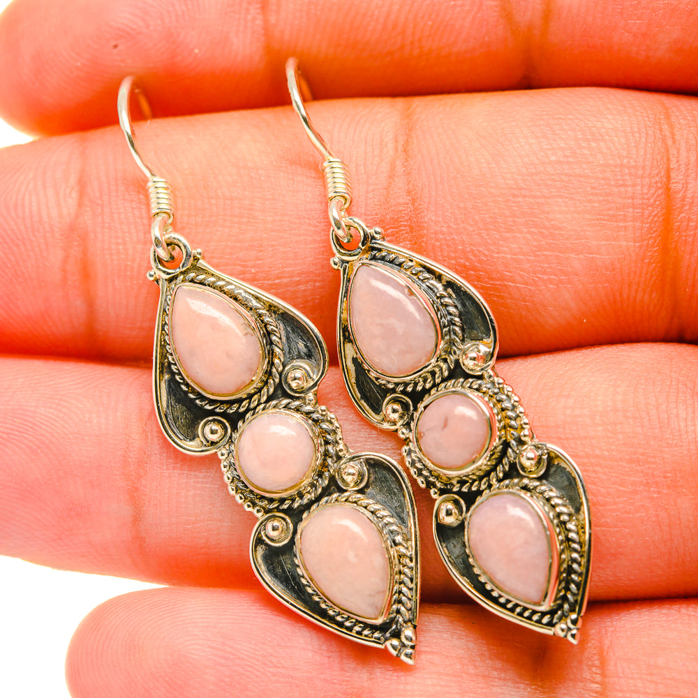 Pink opal dangle earrings in gold-tone filigree with five teardrop stones, hook backs