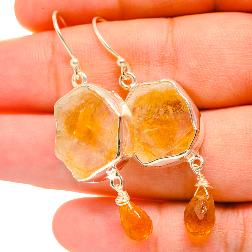 Rough citrine earrings with silver-tone hooks and orange-yellow dangle drops