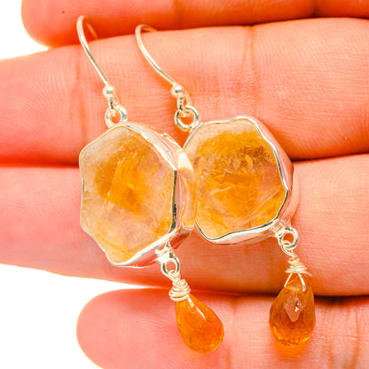Rough citrine earrings with silver-tone hooks and orange-yellow dangle drops