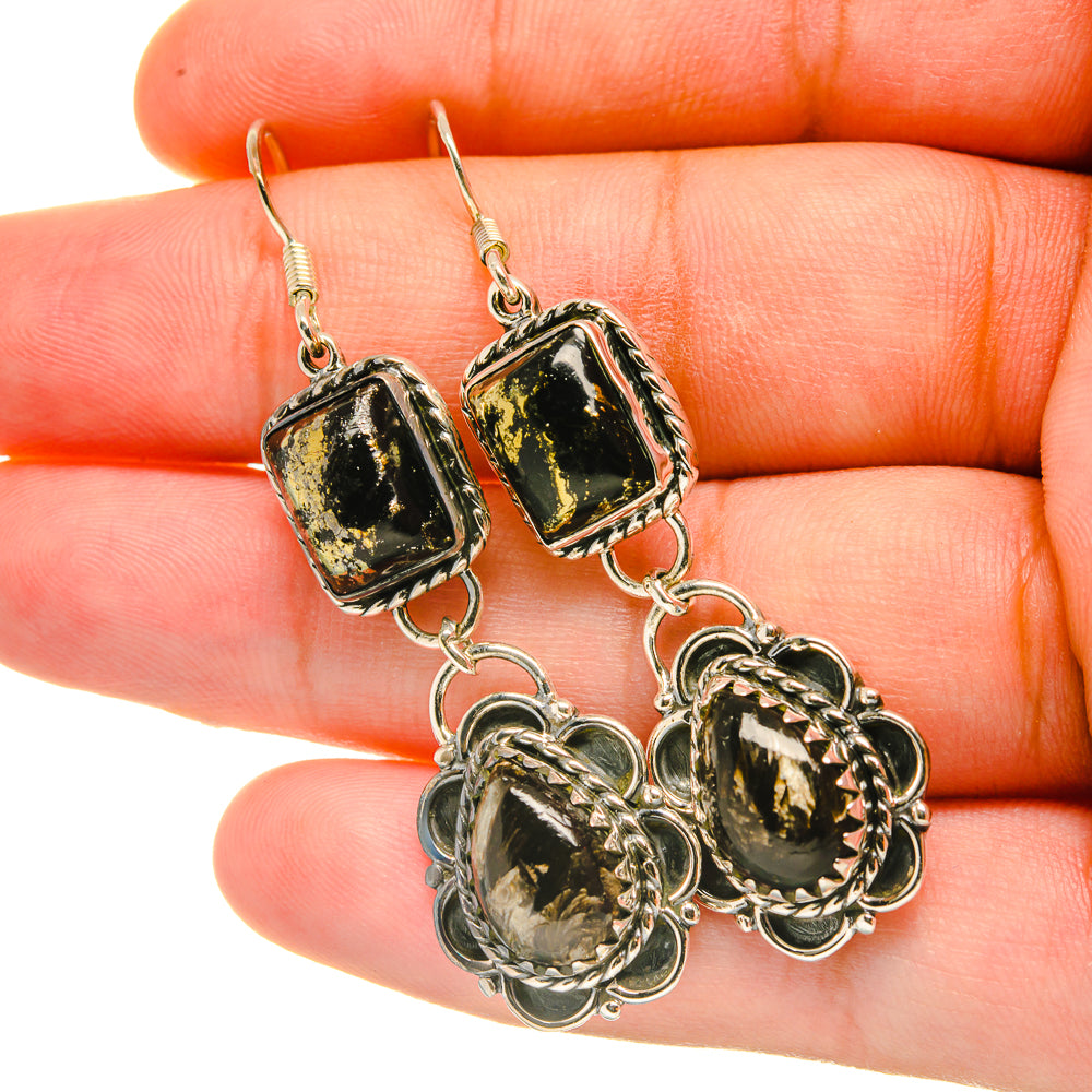 Dangling earrings with green-black rectangular stones and round filigree gemstone details