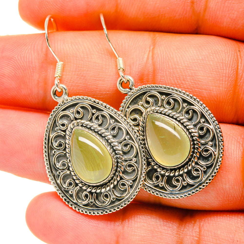 Sterling silver prehnite drop earrings with round filigree frames and light green stones