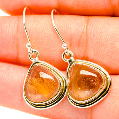 Sterling silver rutilated quartz teardrop earrings with orange-gold stone center