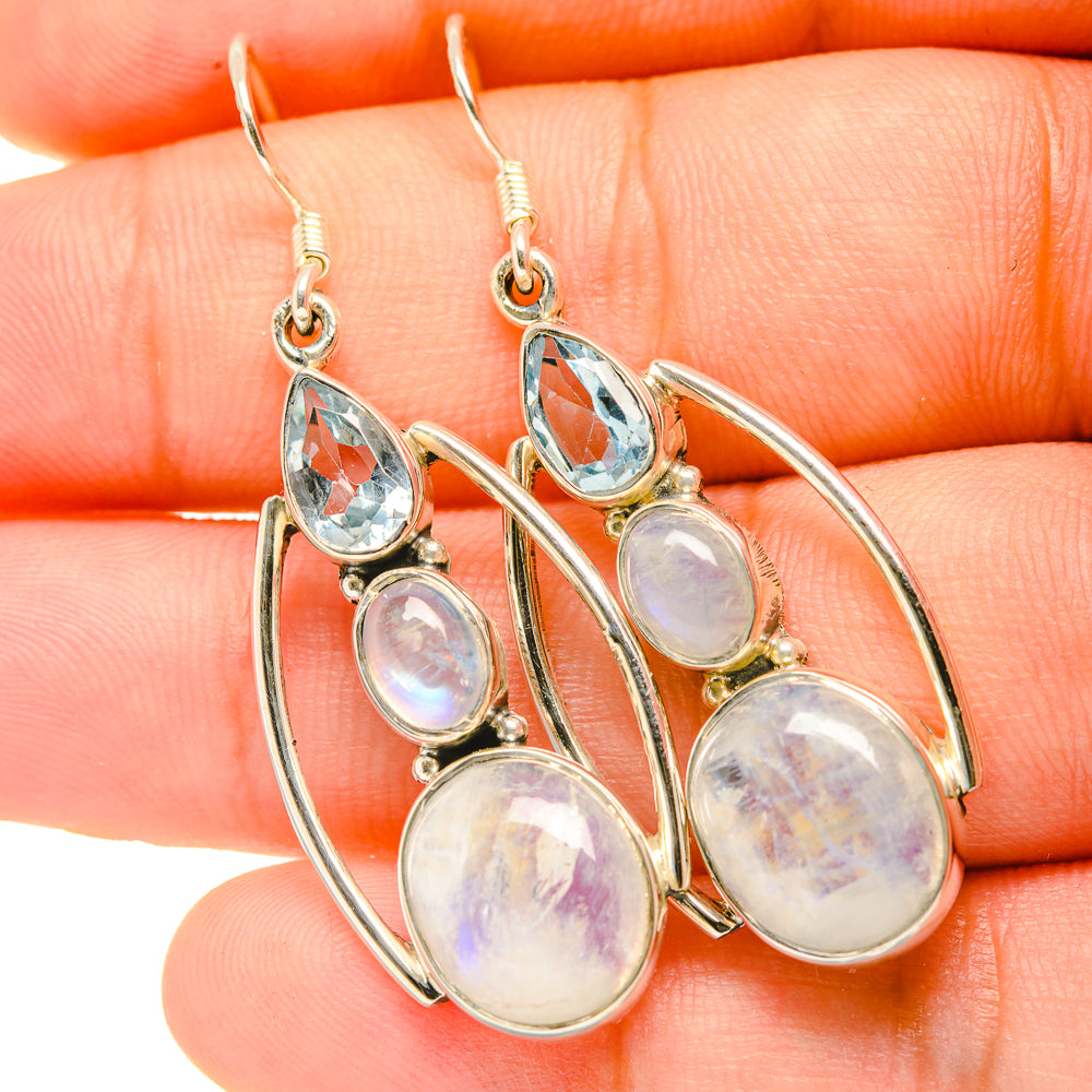 Silver hoop drop earrings with oval blue topaz and opalescent moonstone drops