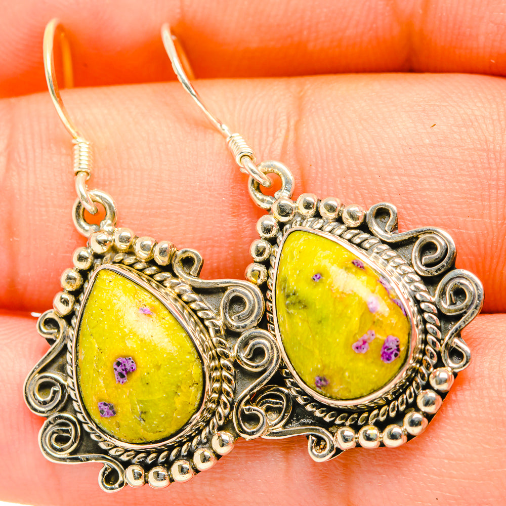 Sterling silver filigree earrings with yellow teardrop stones and purple speckles